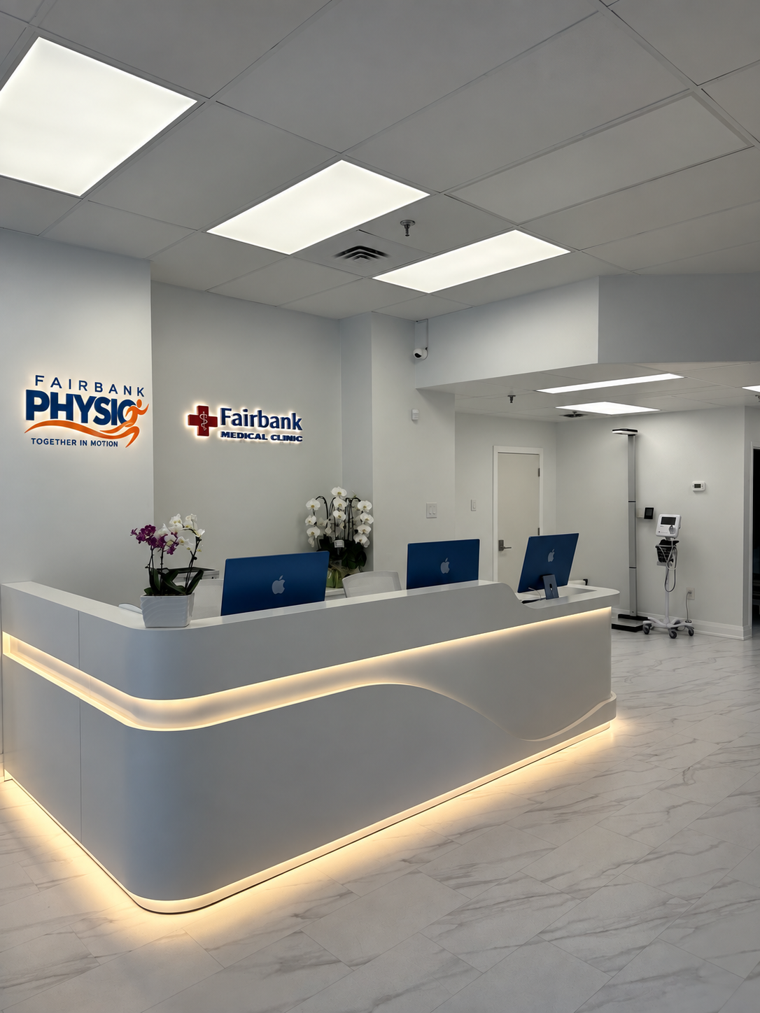 Reception with a visualization of Fairbank Physio signage beside the Fairbank Medical Clinic sign